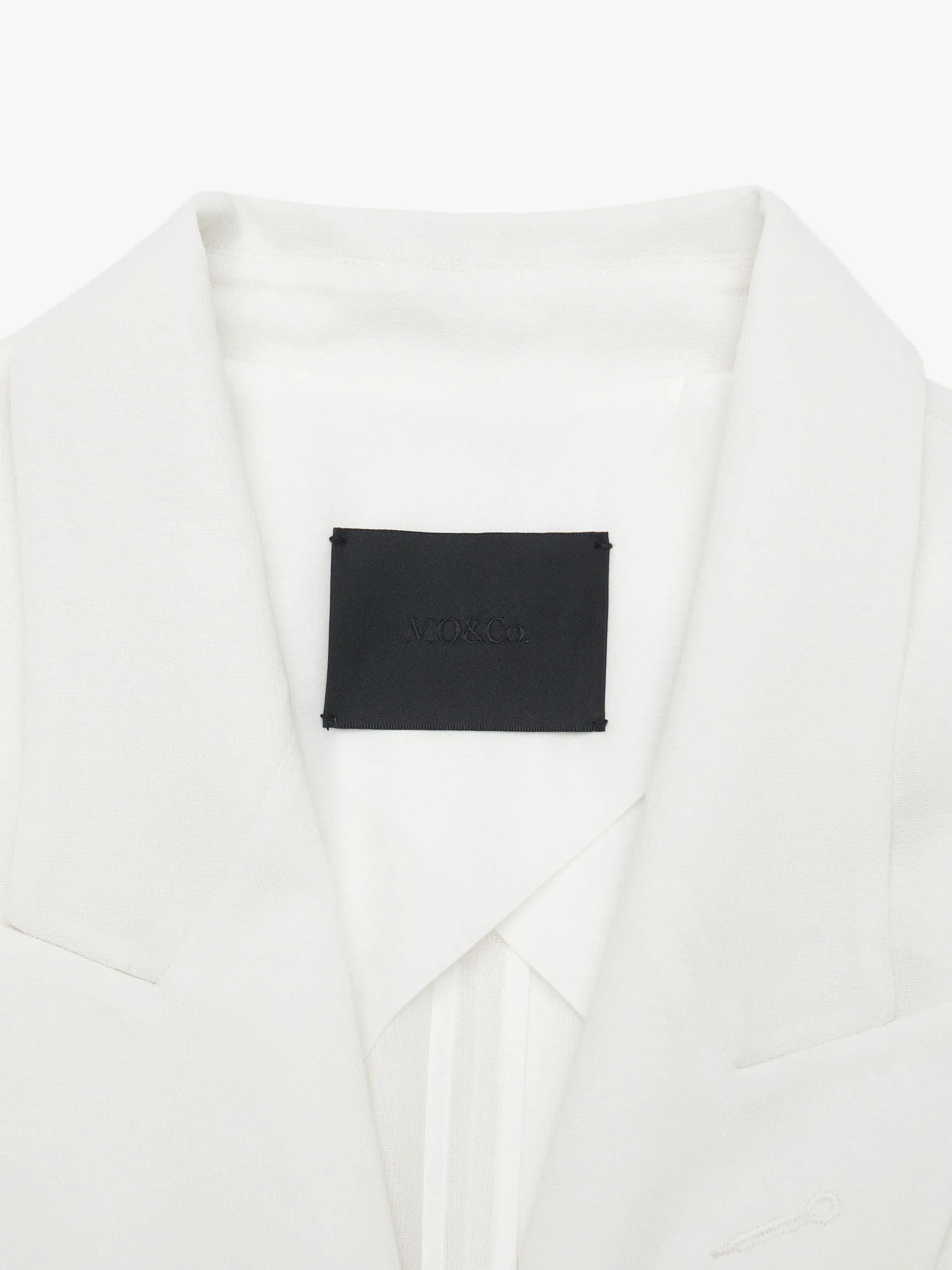 Strukturierter Blazer mit Spitzenrevers