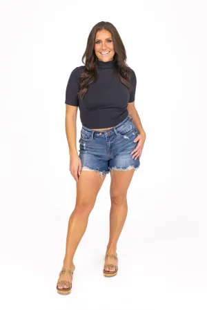 The Emerson from Judy Blue: Mid-Rise 2 Button Dad Fit Denim Shorts